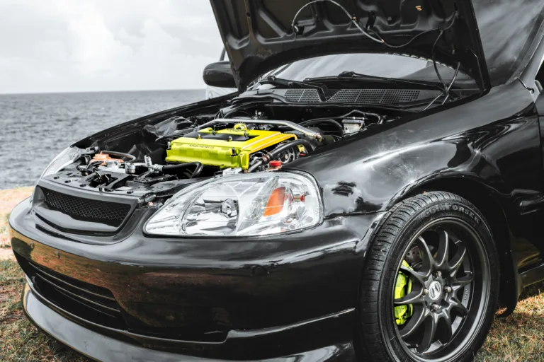 Car hood open showing engine, Car engine.